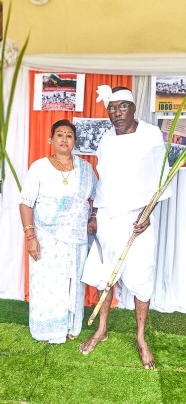 two people dressed as indian indentured labourers