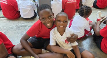 older learners teaching younger children literacy by reading aloud