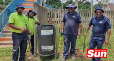 a group photo during a bin installation