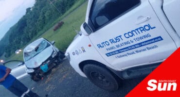 a crashed vehicle and an emergency response vehicle along a road