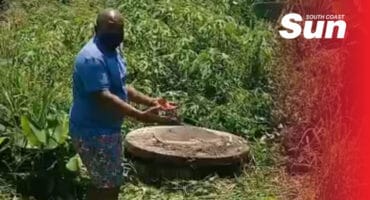 a man showing a manhold