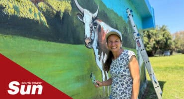 an artist painting a mural