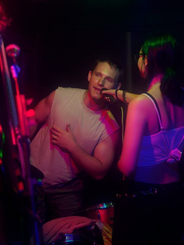 a drummer adding vocals during a song