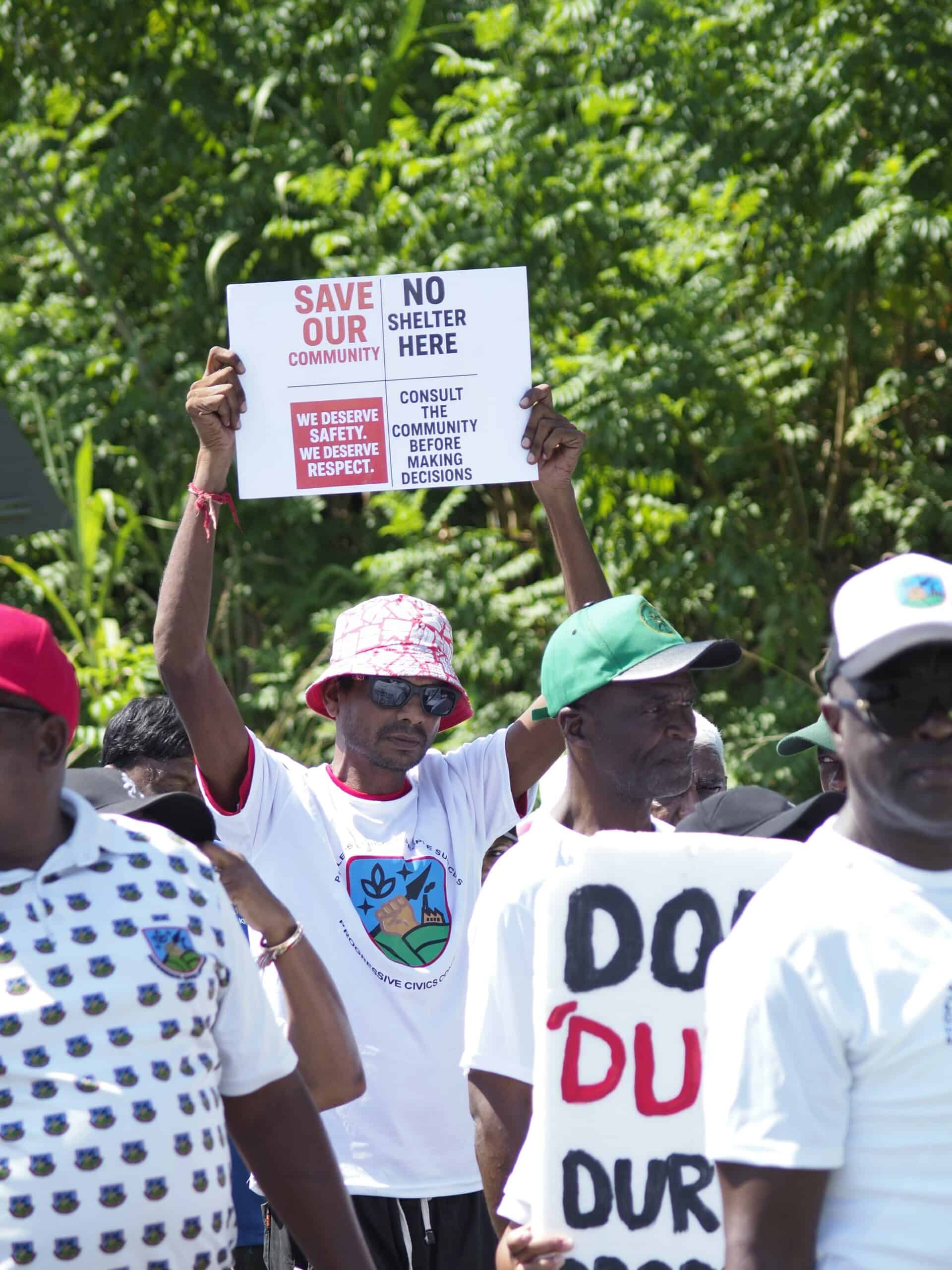 protestors marching and holding up placards
