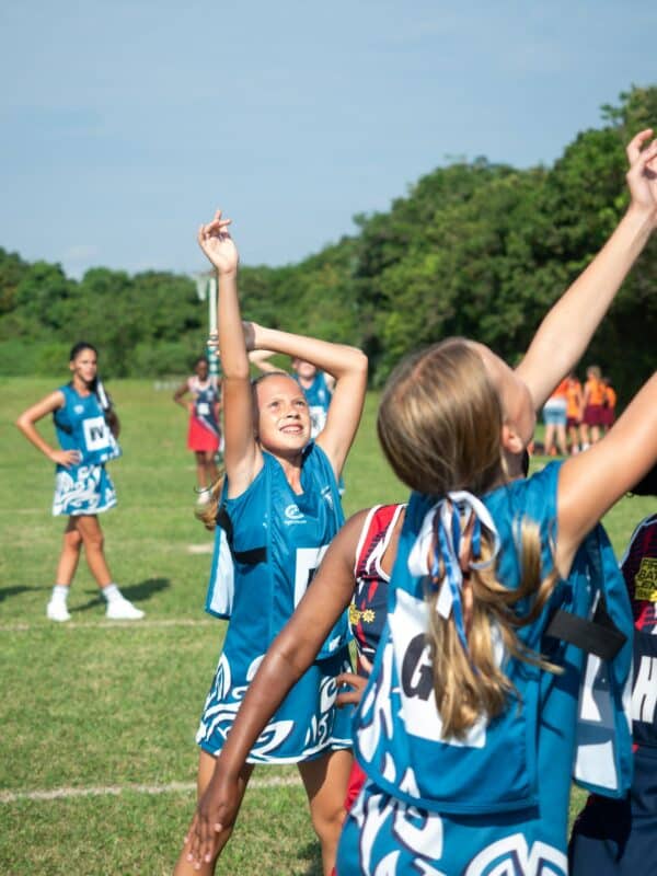 a netball player shooting the ball