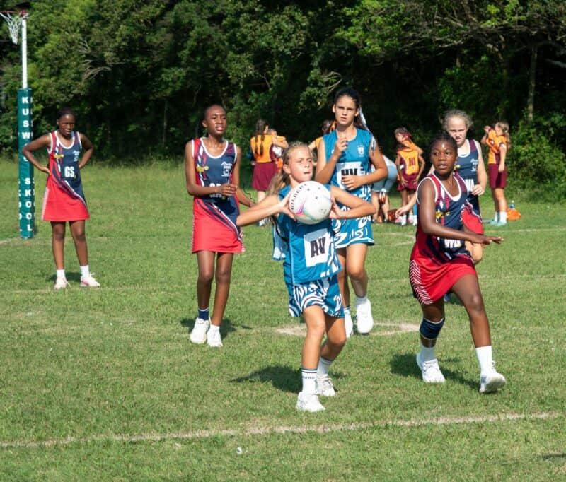 a netball player passing the ball