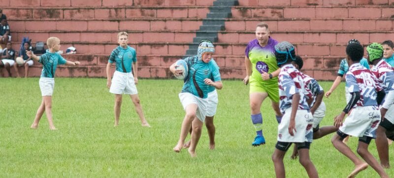 a rugby player running down the field