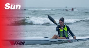 a woman kayaking in the ocean