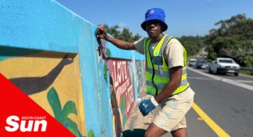 a man painting a bridge