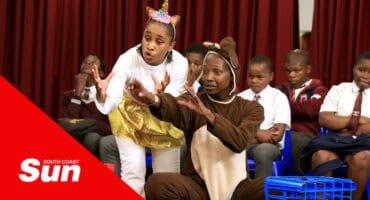 two actors dressed up in animal outfits as part of a play