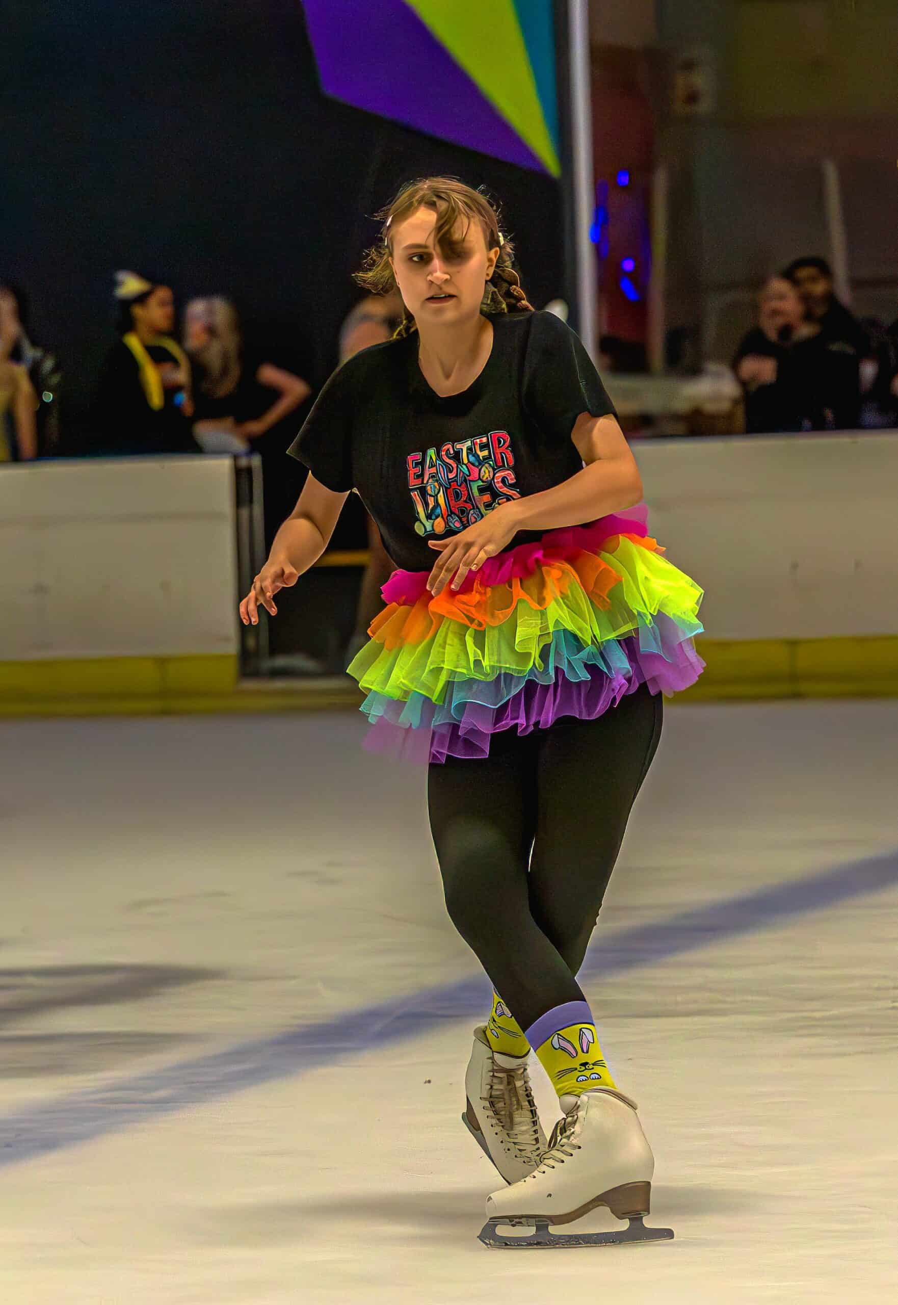 a figure skating gliding along in an ice rink