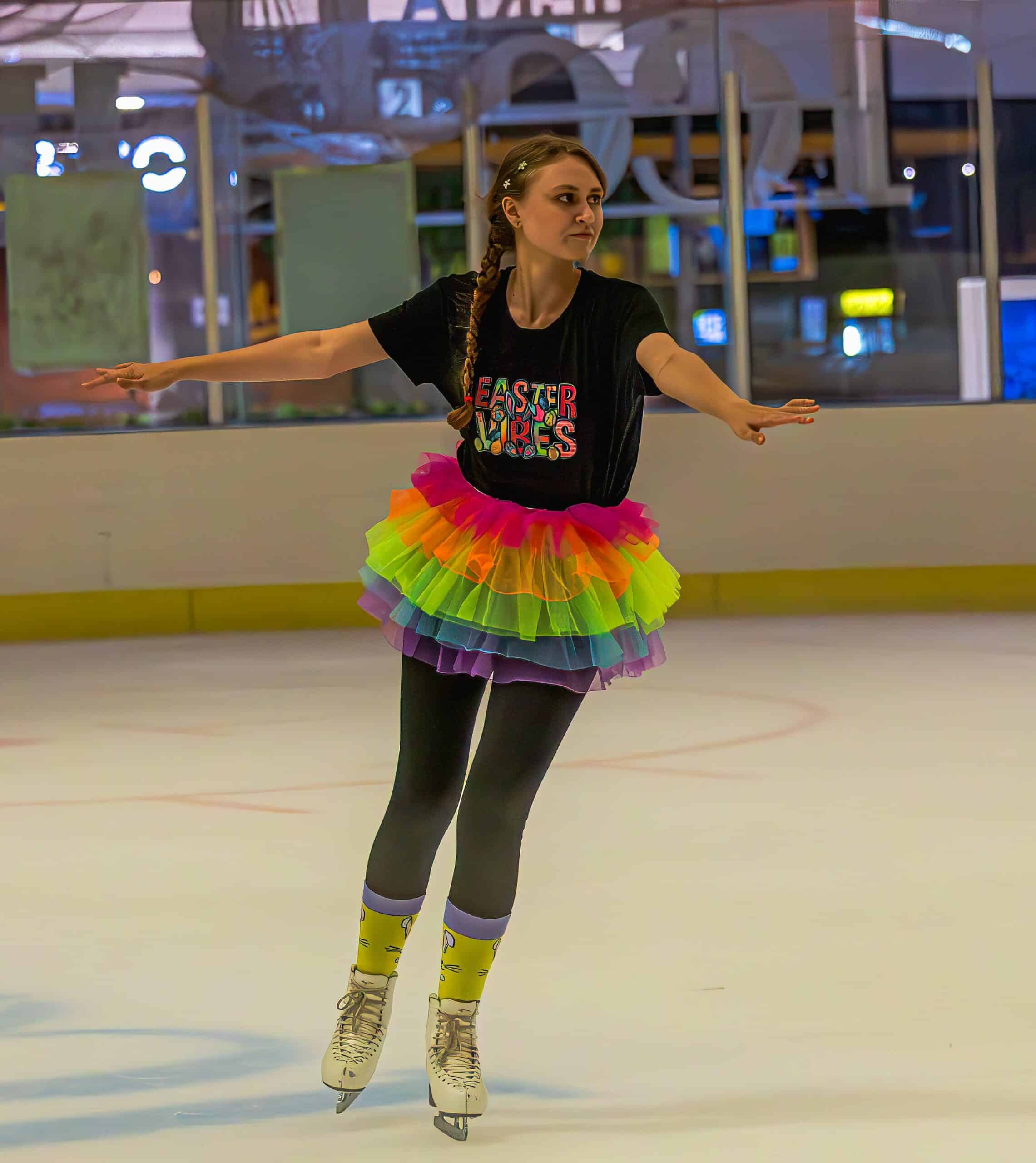 a figure skating gliding along in an ice rink