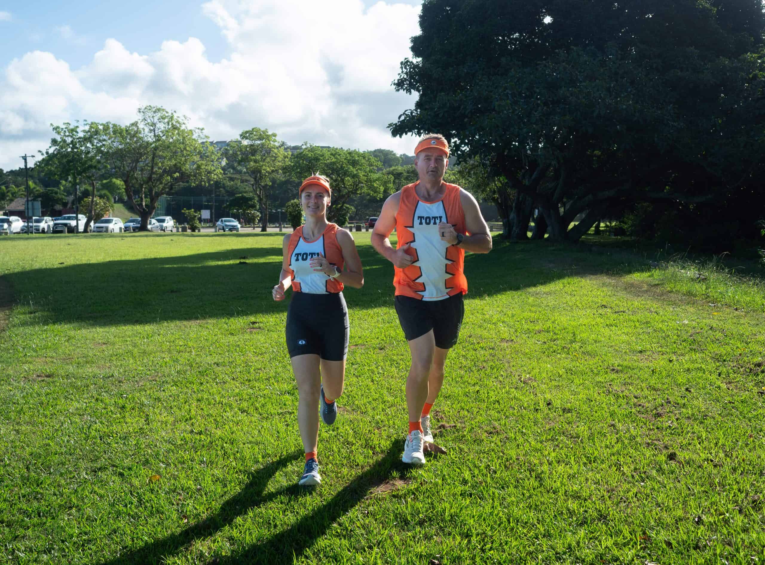 Amanzimtoti power couple to tackle Comrades together two runners in their gear training together in a field
