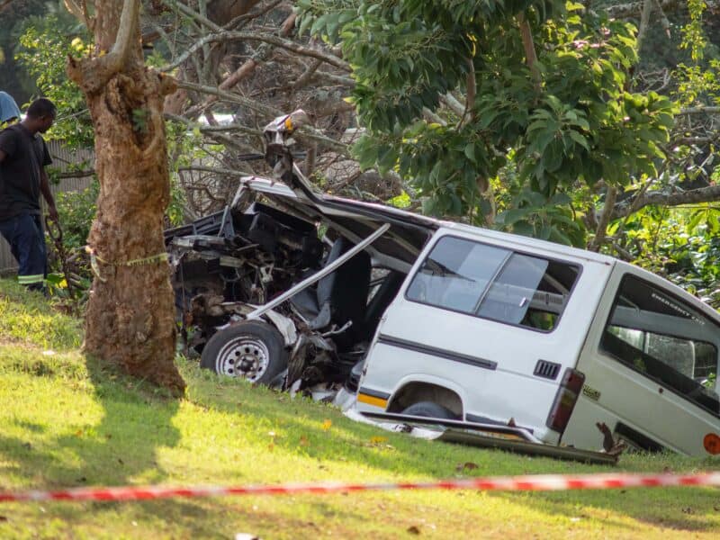 an accident scene involving a severely damaged taxi
