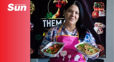 a chef holding up some of her meals