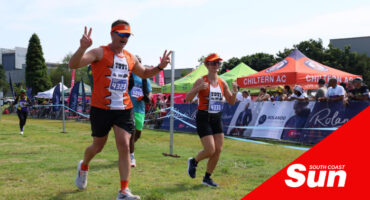 two runners crossing the finish line together