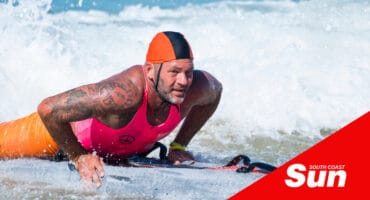 a man on a surfboard in the water