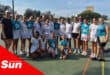 a group photograph on a netball court of sports players