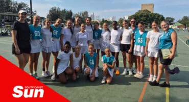 a group photograph on a netball court of sports players
