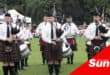 pipe bands playing at a highland gathering
