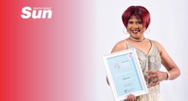 a portrait of a woman hold an awards certificate