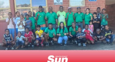 a large group photograph of a soccer academy
