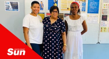 a group photograph of three women