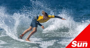 a man surfing in the ocean