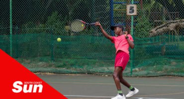 a tennis player returning the ball for a rally