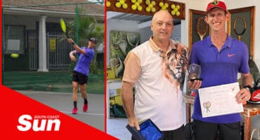 a tennis player on the court. a man handing over a trophy and certificate to another man