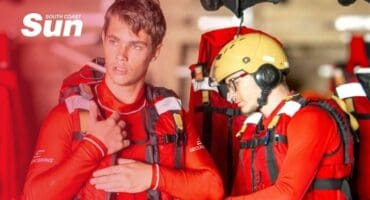 Two men dressed in wet suites checking their NSRI gear