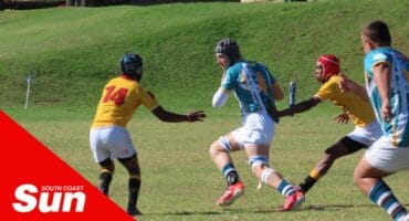 Four rugby players on the field