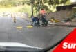 road workers installing a low profile metal speed bump
