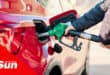 an image of a person filling fuel in their car