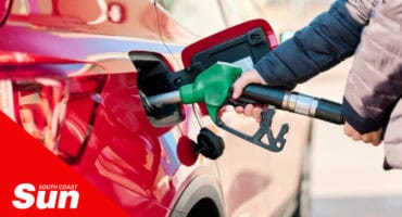 an image of a person filling fuel in their car
