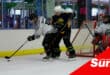 ice hockey players trying to get possession of the puck