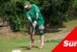 a man playing golf, about to tee off