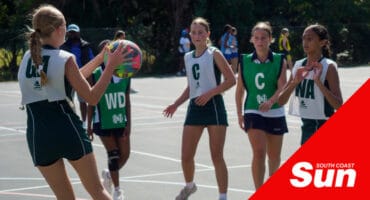 a netball match being played on combined courts