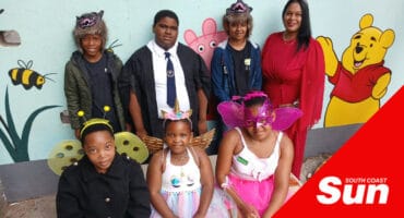 a group photograph of school children dressed up as fantasy characters
