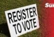 Register to vote board on grass