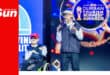 a disabled person accepts a tourism award with his able-bodied father