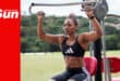 a female bodybuilder makes use of outdoor gym equipment