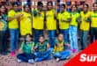 a group photograph of children wearing a soccer tee shirt