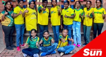 a group photograph of children wearing a soccer tee shirt