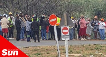 a group of protestors along the street