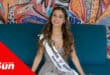 a teenage pageant princess shows her sash in a model shoot