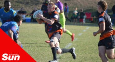 a rugby player runs with the ball