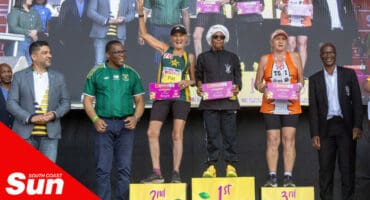 a group photograph with athletes and officials at a race