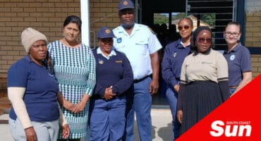 a group photograph with police officers and speakers at a child care centre