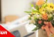 flowers in the foreground and a hospital bed in the background